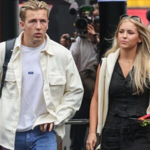 AUSTIN, TX - OCTOBER 18: Visa Cash App RB Formula One Team driver Liam Lawson (3) of New Zealand walks into the paddock with Hannah St. John before the first practice session of the Formula 1 Pirelli United States Grand Prix on October 18, 2024, at Circuit of The Americas in Austin, Texas.