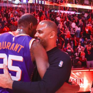 Phoenix Suns forward Kevin Durant (35) hugs Houston Rockets head coach Ime Udoka after a game at Toyota Center.