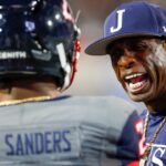 Jackson State head coach Deion Sanders yells at Jackson State safety Shilo Sanders (21) on the sideline in the Southern Heritage Classic between Tennessee State University and Jackson State University at Liberty Bowl Memorial Stadium in Memphis, Tenn., on Saturday