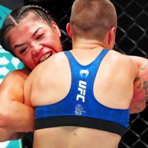 Rose Namajunas (red gloves) fights Tracy Cortez (blue gloves) during UFC Fight Night at Ball Arena