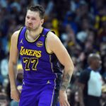 Los Angeles Lakers guard Luka Doncic (77) celebrates after a basket during the first half against the Denver Nuggets at Ball Arena.