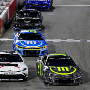 Feb 2, 2025; WInston-Salem, North Carolina, USA; NASCAR Cup Series driver Tyler Reddick (45) and NASCAR Cup Series driver Ross Chastain (1) during the Clash at Bowman Gray at Bowman Gray Stadium. Mandatory Credit: Peter Casey-Imagn Images