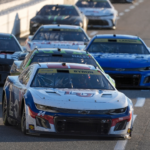 Nov 3, 2024; Martinsville, Virginia, USA; NASCAR Cup Series driver William Byron (24) leads a group into turn three during the Xfinity 500 at Martinsville Speedway. Mandatory Credit: Jim Dedmon-Imagn Images