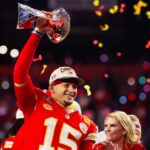 Kansas City Chiefs quarterback Patrick Mahomes (15) celebrates with the Vince Lombardi Trophy after defeating the San Francisco 49ers in overtime of Super Bowl LVIII at Allegiant Stadium.