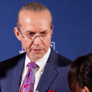 Former NASCAR drivers Richard Petty shows off custom vest with his son Kyle Petty on the red carpet before the 2025 NASCAR Hall of Fame Induction Ceremony at Charlotte Convention Center Crown Ballroom.