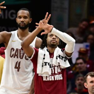 Cleveland Cavaliers forward Evan Mobley (4) and guard Darius Garland (10) celebrate after guard Sam Merrill (not pictured) hit a three point basket during the second half against the Dallas Mavericks at Rocket Mortgage FieldHouse