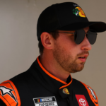 Feb 16, 2025; Daytona Beach, Florida, USA; NASCAR Cup Series driver Chase Briscoe (19) walks to the drivers meeting before the Daytona 500 at Daytona International Speedway. Mandatory Credit: Peter Casey-Imagn Images