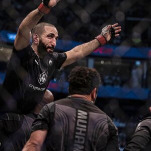Belal Muhammad (red gloves) defeats Sean Brady (blue gloves) during UFC 280 at Etihad Arena.