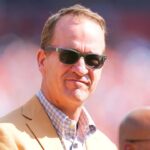 American former football player Peyton Manning before the game against the Las Vegas Raiders at Empower Field at Mile High.