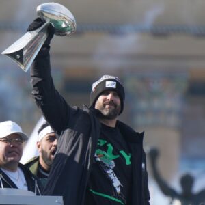 Philadelphia Eagles head coach Nick Sirianni raises the Vince Lombardi Trophy during the Super Bowl LIX championship parade and rally.
