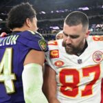 Kansas City Chiefs tight end Travis Kelce (87) greets Baltimore Ravens safety Kyle Hamilton (14) after their AFC Championship football game at M&T Bank Stadium.