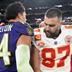 Kansas City Chiefs tight end Travis Kelce (87) greets Baltimore Ravens safety Kyle Hamilton (14) after their AFC Championship football game at M&T Bank Stadium.