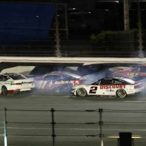 Feb 16, 2025; Daytona Beach, Florida, USA; NASCAR Cup Series driver Denny Hamlin (11), driver Cole Custer (41) and driver Corey LaJoie (01) wreck on the final lap during the Daytona 500 at Daytona International Speedway. Mandatory Credit: Mark J. Rebilas-Imagn Images