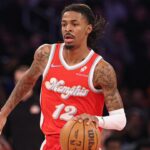 Memphis Grizzlies guard Ja Morant (12) dribbles up court during the first half against the Memphis Grizzlies at Madison Square Garden.
