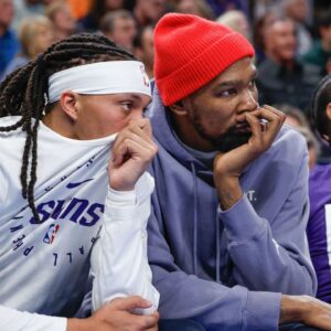 Phoenix Suns guard Damion Lee (10) and Phoenix Suns forward Kevin Durant (35) watch their team play against the Oklahoma City Thunder during the second half of a game at Paycom Center.