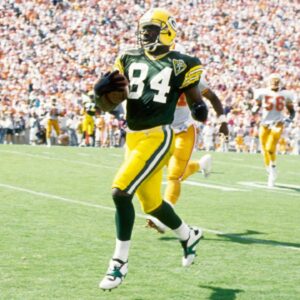 Oct 24, 1993; Tampa, FL, USA; Green Bay Packers receiver Sterling Sharpe (84) scores a touchdown against the Tampa Bay Buccaneers at Tampa Stadium.