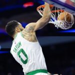 Boston Celtics forward Jayson Tatum (0) dunks the ball against the Philadelphia 76ers during the second quarter at Wells Fargo Center
