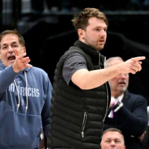 Dallas Mavericks guard Luka Doncic (right) and Mark Cuban (left) argue a call during the second half of the game against the New Orleans Pelicans at the American Airlines Center