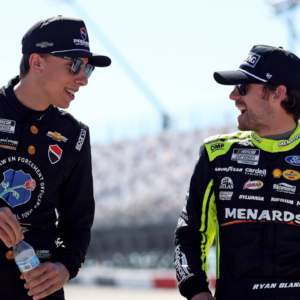 NASCAR Cup Series driver Carson Hocevar (77) and NASCAR Cup Series driver Ryan Blaney (12) during practice for the Goodyear 400 at Darlington Raceway.