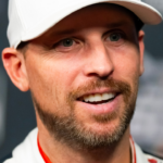 Feb 12, 2025; Daytona Beach, Florida, USA; NASCAR Cup Series driver Denny Hamlin during Daytona 500 media day at Daytona International Speedway. Mandatory Credit: Mark J. Rebilas-Imagn Images