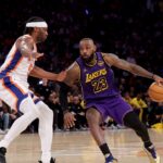 Los Angeles Lakers forward LeBron James (23) controls the ball against New York Knicks forward Precious Achiuwa (5) during the third quarter at Madison Square Garden.