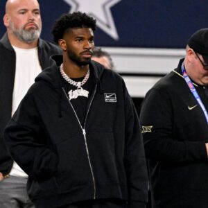 West quarterback Shedeur Sanders of Colorado (2) looks on from the sidelines during the first half against the East at AT&T Stadium.