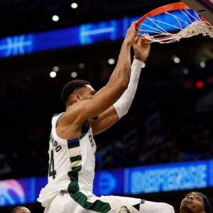 Milwaukee Bucks forward Giannis Antetokounmpo (34) dunks the ball as Washington Wizards guard Bilal Coulibaly (0) looks on in the first half at Capital One Arena