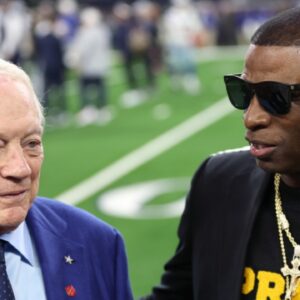 Colorado Buffaloes head coach Deion Sanders (right) talks with Dallas Cowboys owner Jerry Jones before the game against the Seattle Seahawks at AT&T Stadium.