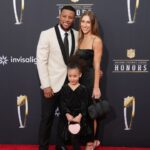 Saquan Barkley with Anna Congdon and daughter Jada Clare Barkley on the red carpet before the NFL Honors show at Resorts World Theatre.