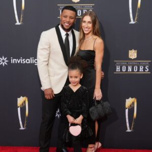 Saquan Barkley with Anna Congdon and daughter Jada Clare Barkley on the red carpet before the NFL Honors show at Resorts World Theatre.
