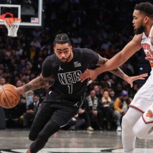 Brooklyn Nets guard D'Angelo Russell (1) drives past New York Knicks center Karl-Anthony Towns (32) in the third quarter at Barclays Center.