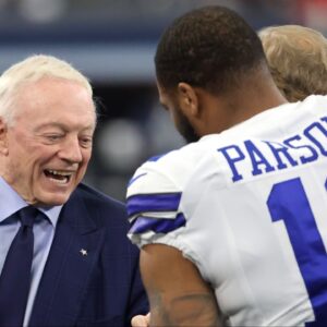 Dallas Cowboys owner Jerry Jones meets with outside linebacker Micah Parsons (11) prior to the NFC Wild Card playoff football game against the San Francisco 49ers at AT&T Stadium.
