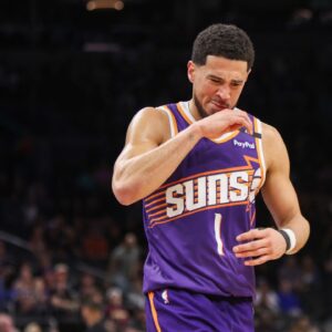 Phoenix Suns guard Devin Booker (1) reacts after being fouled by the New Orleans Pelicans in the fourth quarter at Footprint Center