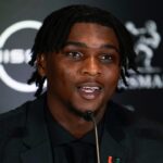 Miami Hurricanes quarterback Cam Ward speaks on stage during a press conference before the 2024 Heisman Trophy Presentation.