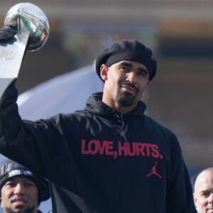 Feb 14, 2025; Philadelphia, PA, USA; Philadelphia Eagles quarterback Jalen Hurts holds the Vince Lombardi Trophy during the Super Bowl LIX championship parade and rally.