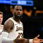 Los Angeles Lakers forward LeBron James (23) and guard Dalton Knecht (4) reacts to a ref’s call against the Sacramento Kings during the first half at Crypto.com Arena.