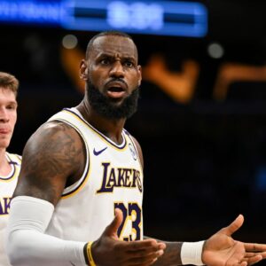 Los Angeles Lakers forward LeBron James (23) and guard Dalton Knecht (4) reacts to a ref’s call against the Sacramento Kings during the first half at Crypto.com Arena.