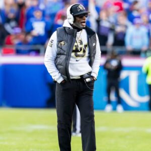 Colorado head coach Deion Sanders paces the field during the 2nd quarter between the Kansas Jayhawks and the Colorado Buffaloes at GEHA Field at Arrowhead Stadium.