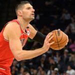 Chicago Bulls center Nikola Vucevic (9) shoots the ball against the Minnesota Timberwolves during the first quarter at Target Center.
