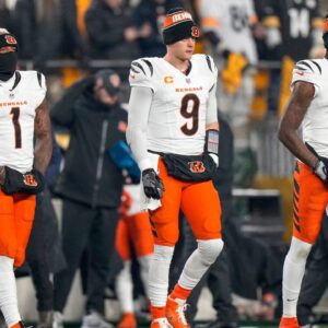 Cincinnati Bengals wide receiver Ja'Marr Chase (1), quarterback Joe Burrow (9) and wide receiver Tee Higgins (5) take the field as captains for the coin toss before the first quarter of the NFL Week 18 game between the Pittsburgh Steelers and the Cincinnati Bengals at Acrisure Stadium in Pittsburgh on Saturday, Jan.