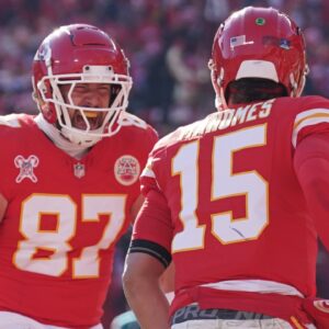 Dec 21, 2024; Kansas City, Missouri, USA; Kansas City Chiefs tight end Travis Kelce (87) celebrates with quarterback Patrick Mahomes (15) after Mahomes’ touchdown against the Houston Texans during the first half at GEHA Field at Arrowhead Stadium.