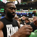 Boston Celtics guard Jaylen Brown (7) signs autographs before a game against the San Antonio Spurs at the TD Garden.