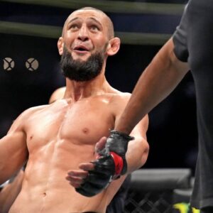 Khamzat Chimaev (red gloves) fights Kevin Holland (blue gloves) during UFC 279 at T-Mobile Arena.