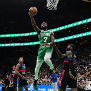 Boston Celtics guard Jaylen Brown (7) shoots a layup against the Detroit Pistons during the second half at TD Garden.