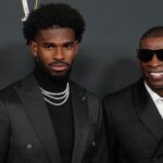 Deion Sanders (right) with his son Shedeur Sanders on the red carpet before Super Bowl LIX NFL Honors at Saenger Theatre.