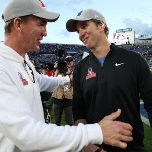 NFC coach Eli Manning and AFC coach Peyton Manning react after the 2024 Pro Bowl at Camping World Stadium.