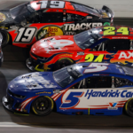 Feb 16, 2025; Daytona Beach, Florida, USA; NASCAR Cup Series driver Chase Briscoe (19), driver William Byron (24) and driver Kyle Larson (5) race three wide during the Daytona 500 at Daytona International Speedway. Mandatory Credit: Peter Casey-Imagn Images