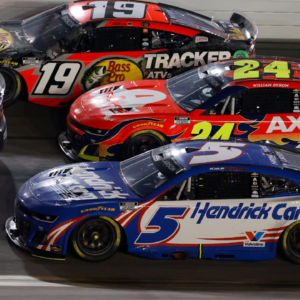 Feb 16, 2025; Daytona Beach, Florida, USA; NASCAR Cup Series driver Chase Briscoe (19), driver William Byron (24) and driver Kyle Larson (5) race three wide during the Daytona 500 at Daytona International Speedway. Mandatory Credit: Peter Casey-Imagn Images