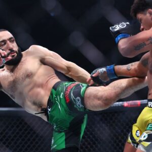 Belal Muhammad (red gloves) fights Gilbert Burns (blue gloves) during UFC 288 at Prudential Center