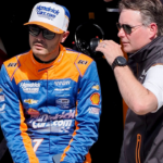 Arrow McLaren/Rick Hendrick driver Kyle Larson (17) sits on the pit wall as he talks with Jeff Gordon on Sunday, May 19, 2024, during Top 12 qualifying for the 108th running of the Indianapolis 500 at Indianapolis Motor Speedway.